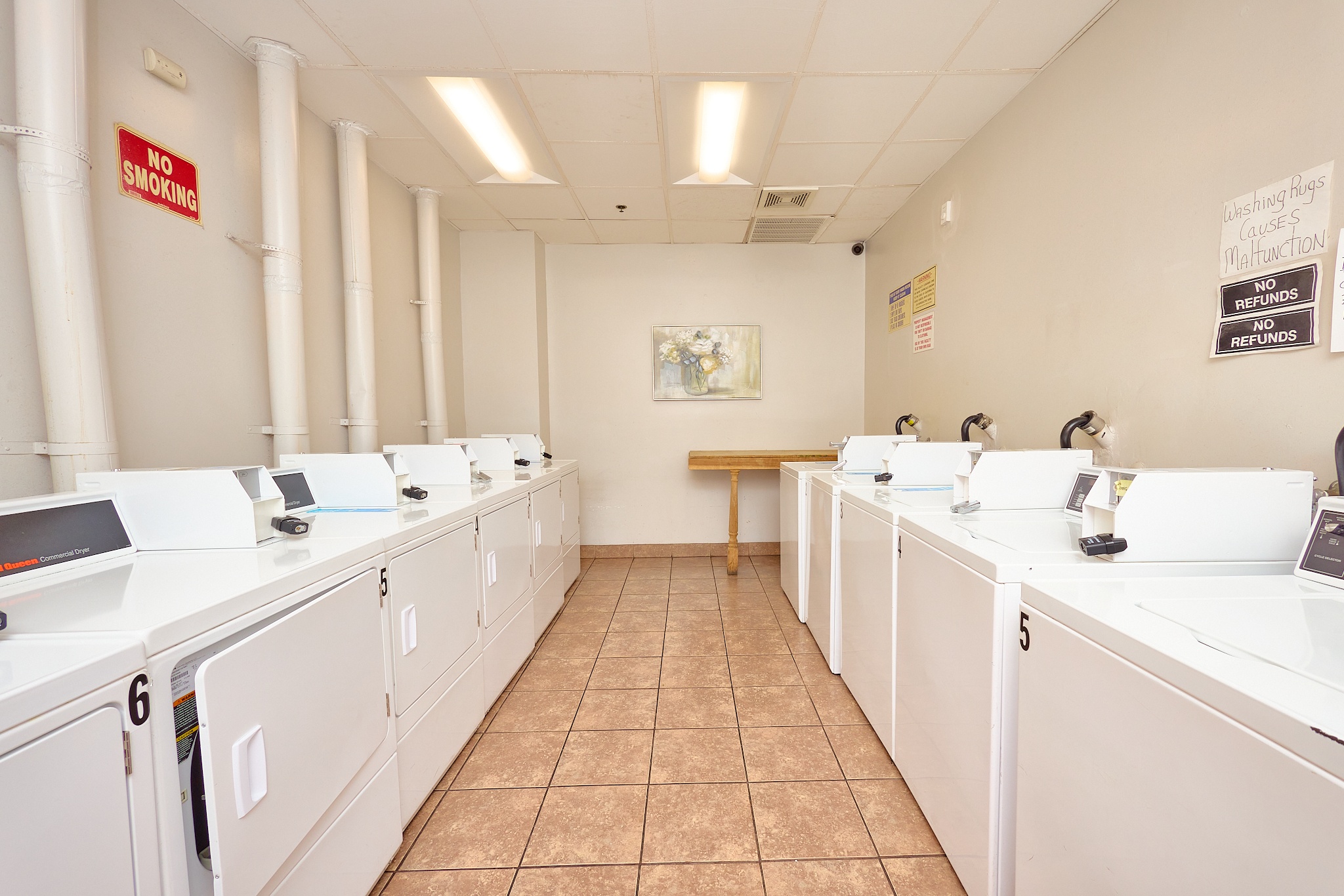 A laundromat with a "No Smoking" sign on the wall.